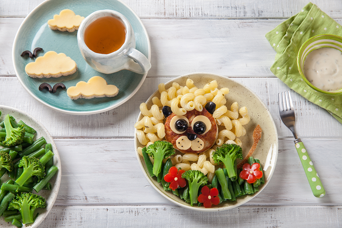 Theme night with animal face food. Noodles and vegetables